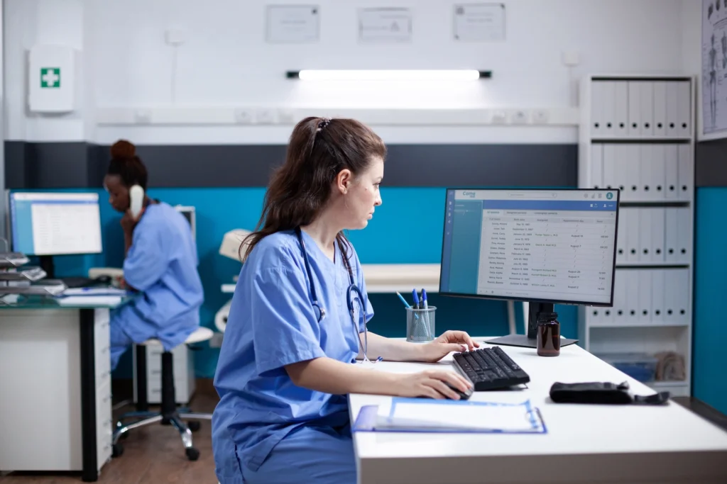 ASC staff coordinating schedules and staffing at a central workstation